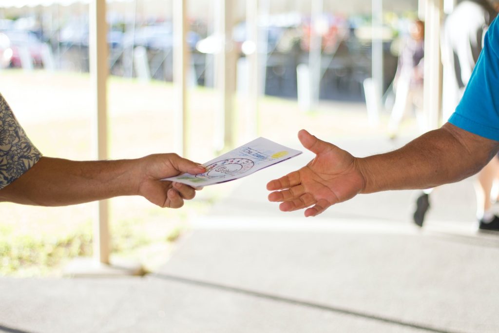 person holding brochure for marketing